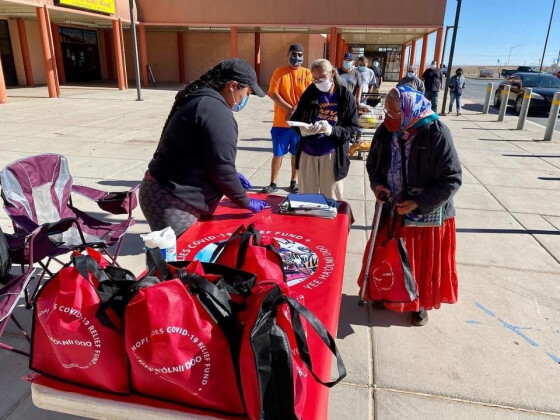 Shandiin Herrera tabling with her team at the Bashas' Dine' Market in Kayenta, AZ: Each team handed out about 1,900 PPE kits at each site. Photo credit: Mateo Herrera