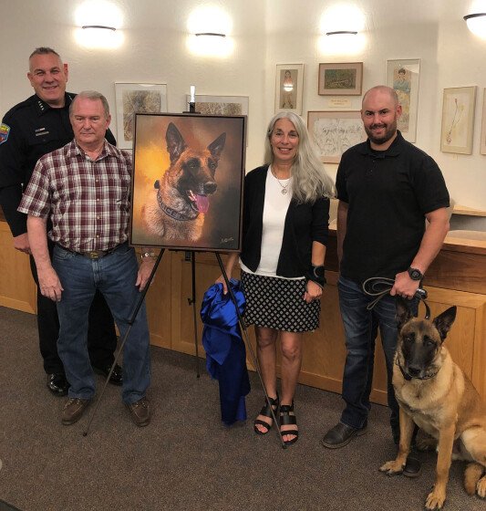 Chief Charles Husted, Robert Albrecht, Arts and Culture Coordinator Nancy Lattanzi and Handler Officer Jonathan Reed with Max. 