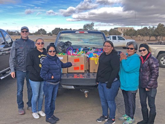 Photo by Bryan Phillips of part of Crossing Worlds Hopi Project December gift delivery to Hopi Foster Care Staff