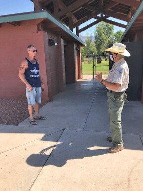 Ranger Greg Stein with a visitor at Posse Ground Park