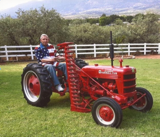 Mr. Rudy Valen of Camp Verde riding his fully restored Farmall Cub, the last one still in existence.