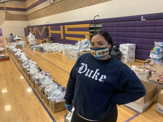Shandiin Herrera and the Monument Valley team assemble food boxes at the Monument Valley High School gymnasium.