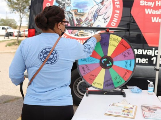 A campaign participant spins the prize wheel at the Window Rock Flea Market. In order to spin the wheel, participants needed to be fully vaccinated and complete a brief survey.