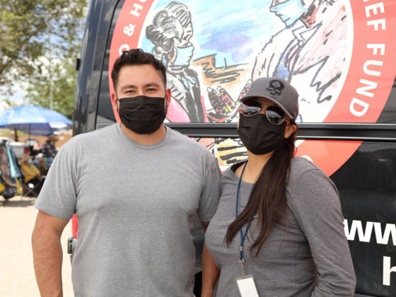 Southeast Navajo team members Christian Vasquez (left) and Pat Nelson (right) provided educational material related to COVID and conducted brief surveys with participants at campaign events. 