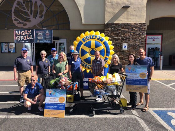 Members of Sedona Village Rotary Club, Clark’s Market and Verde Valley Sanctuary show off the 2021 grocery haul.