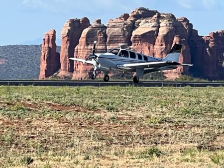 Sedona Airport Releases Hangar Development RFP First Landing by Local Aircraft with Cathedral Rock in Background