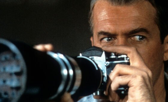 A photographer in a wheelchair (James Stewart) spies on his neighbors from his Greenwich Village courtyard apartment window, and becomes convinced one of them has committed murder, despite the skepticism of his fashion-model girlfriend (Grace Kelly) in “Rear Window”.