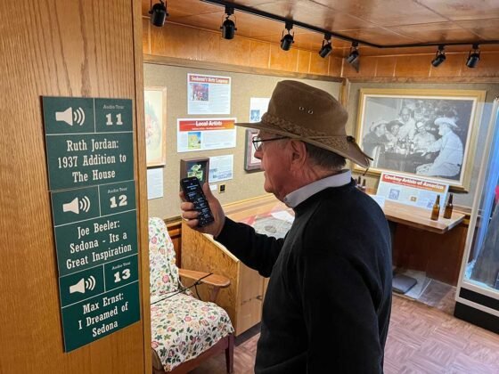 Sedona Heritage Museum Announces New Admission Rates A visitor enjoys the Museum’s audio tour on their smart phone.