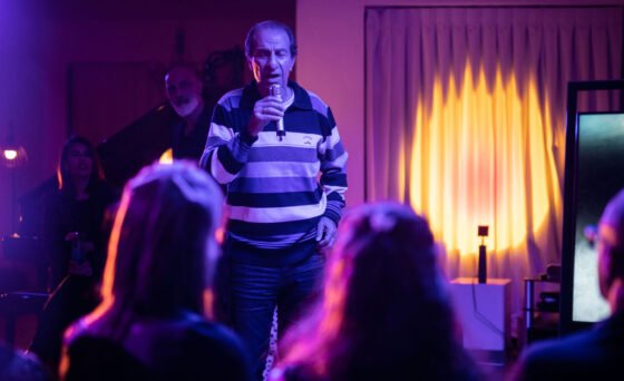 A long-married couple living in an upscale Tel Aviv highrise becomes obsessed with their new, charismatic neighbor and his karaoke parties in “Karaoke”.