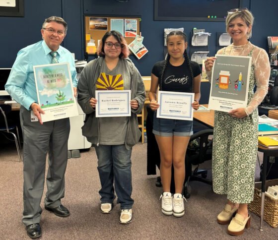 Yavapai County Sheriff’s Office Public Affairs Coordinator Steve Brazell and Yavapai Justice and Mental Health Coalition Public Affairs Officer Heidi Howard award Rachel Rodriguez and Autumn Benally, students at Camp Verde High School, Age Category prizes for the 2024 MATFORCE Youth Poster Contest.