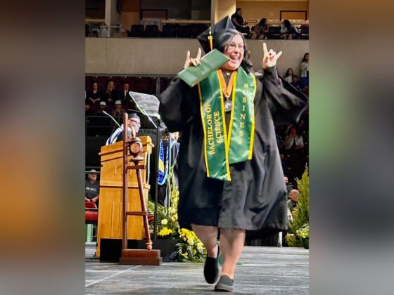 Relentless: YC Alumna Lauren Mitchell Simultaneously Achieves Bachelor’s Degree, Business Dream Lauren Mitchell, the first person to earn a bachelor’s degree at Yavapai College, celebrates while crossing the stage at spring Commencement.