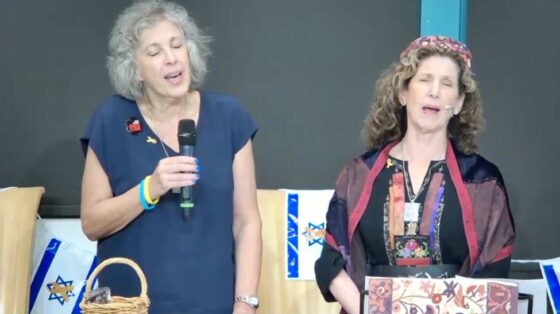 Denise Israel and Rabbi Alicia Magal sing Lu Yehi, a Hebrew song that speaks of hope for peace.