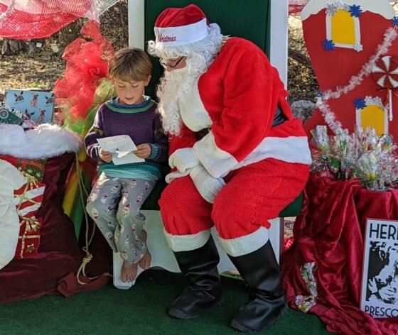 Wild Family Fun at WildLights! Boy with List and Santa
