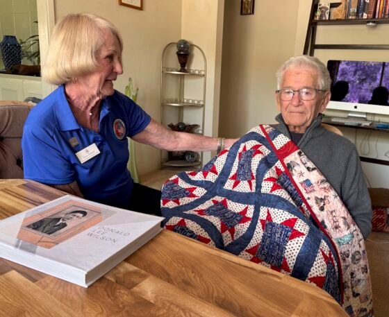 Joyce Ziebarth Don Wilson with album Dons daughters put together