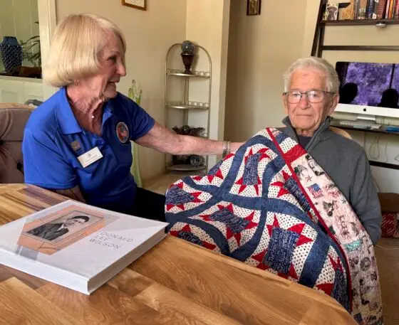 Joyce Ziebarth Don Wilson with album Dons daughters put together