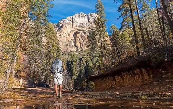 Man Hiking Along The West Fork Trail In Sedona AZ